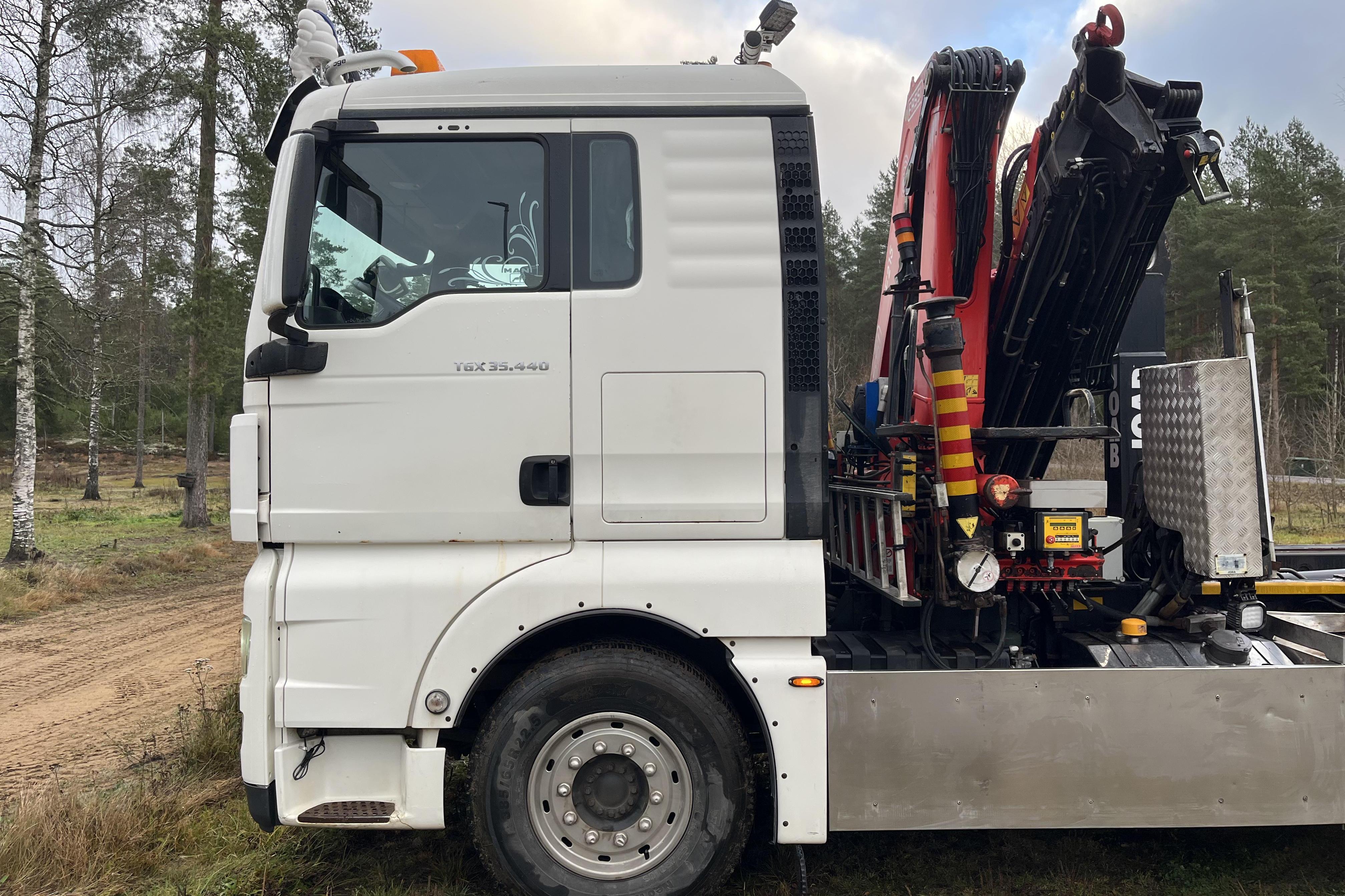 MAN TGX 35.440 8X4-4 BL - 389 065 km - Automatic - white - 2012