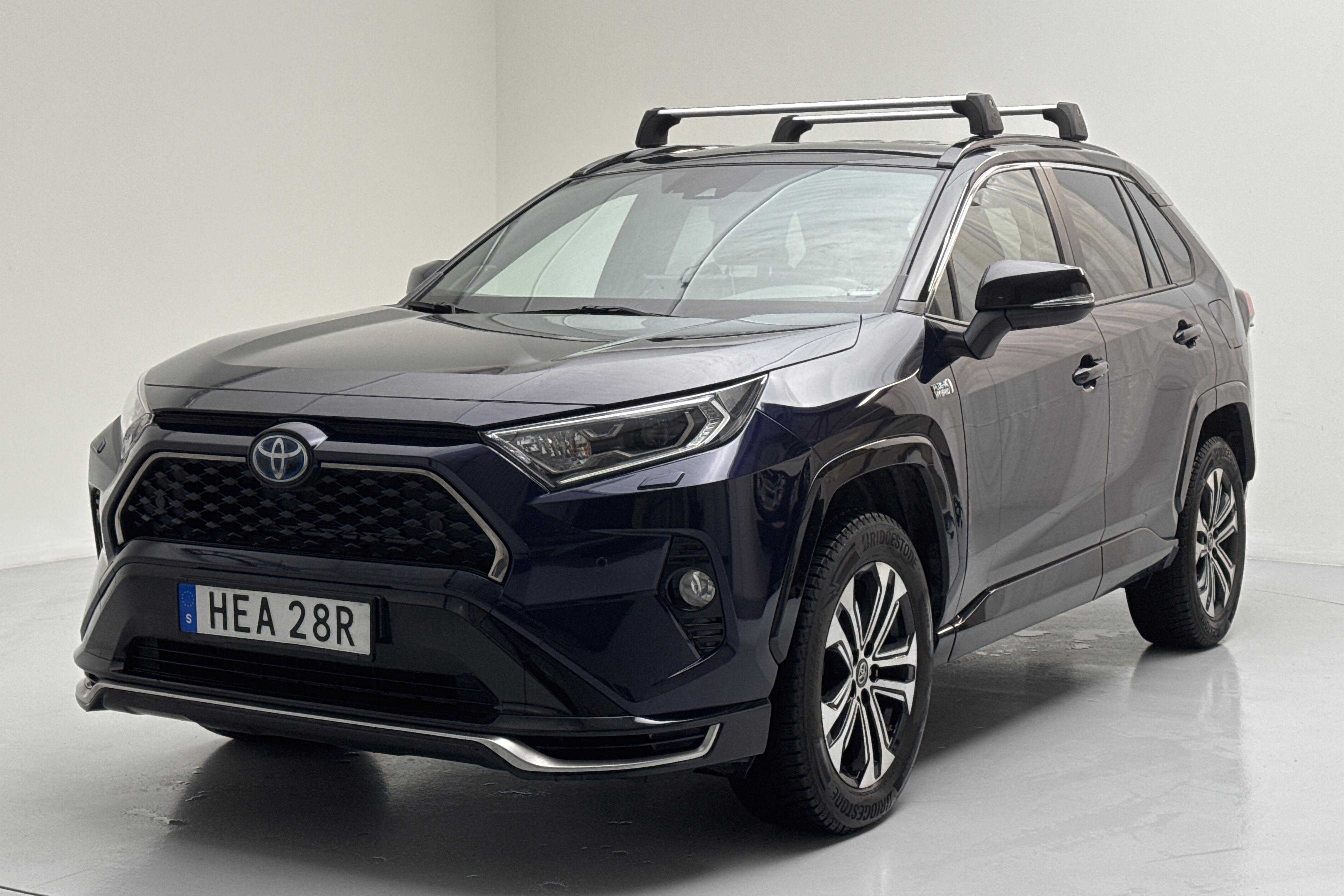 Toyota RAV4 2.5 Plug-in Hybrid AWD (306hk) - 76 400 km - Automatyczna - niebieski - 2021