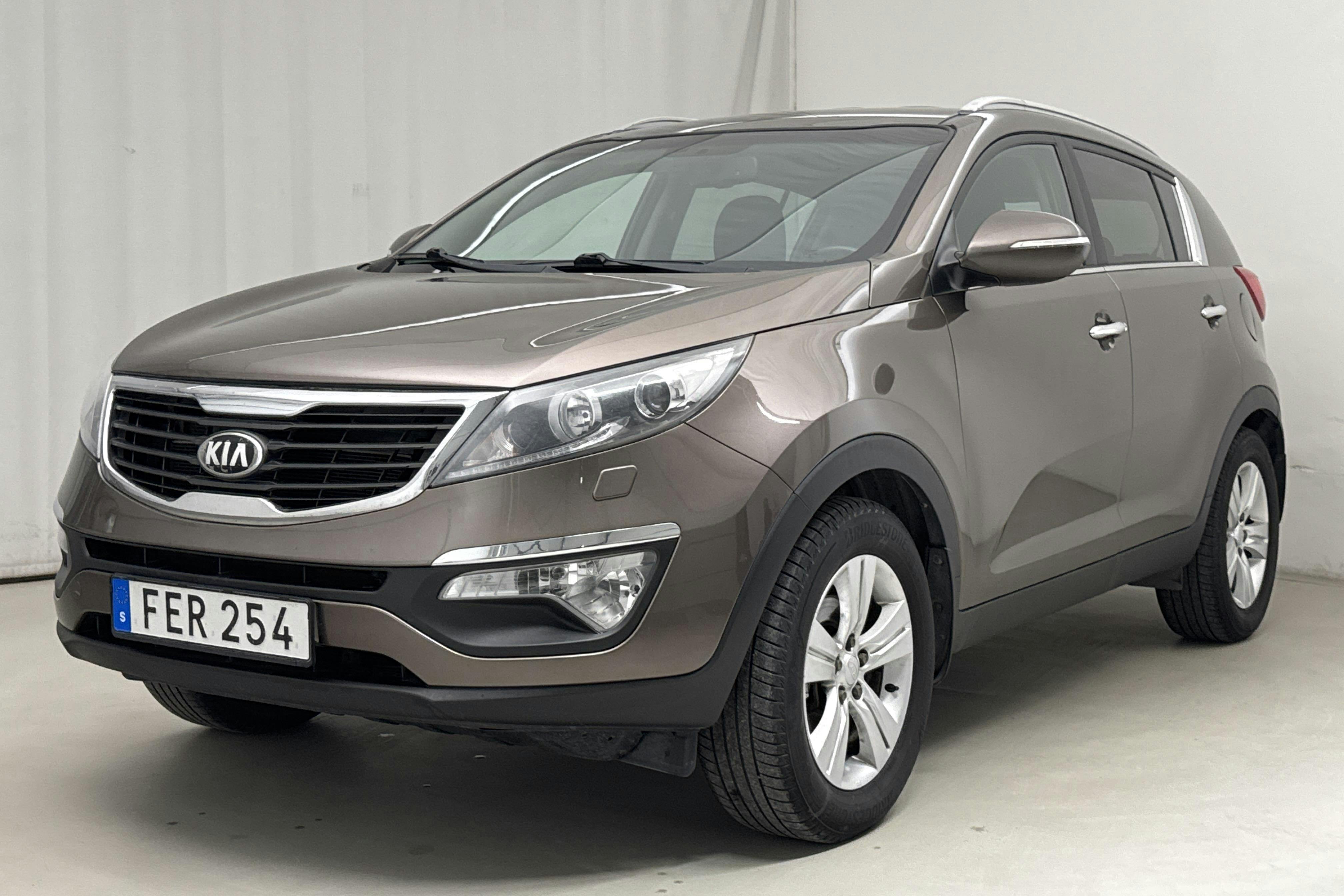 KIA Sportage 1.6 2WD (136hk) - 173 380 km - Manual - Light Brown - 2013