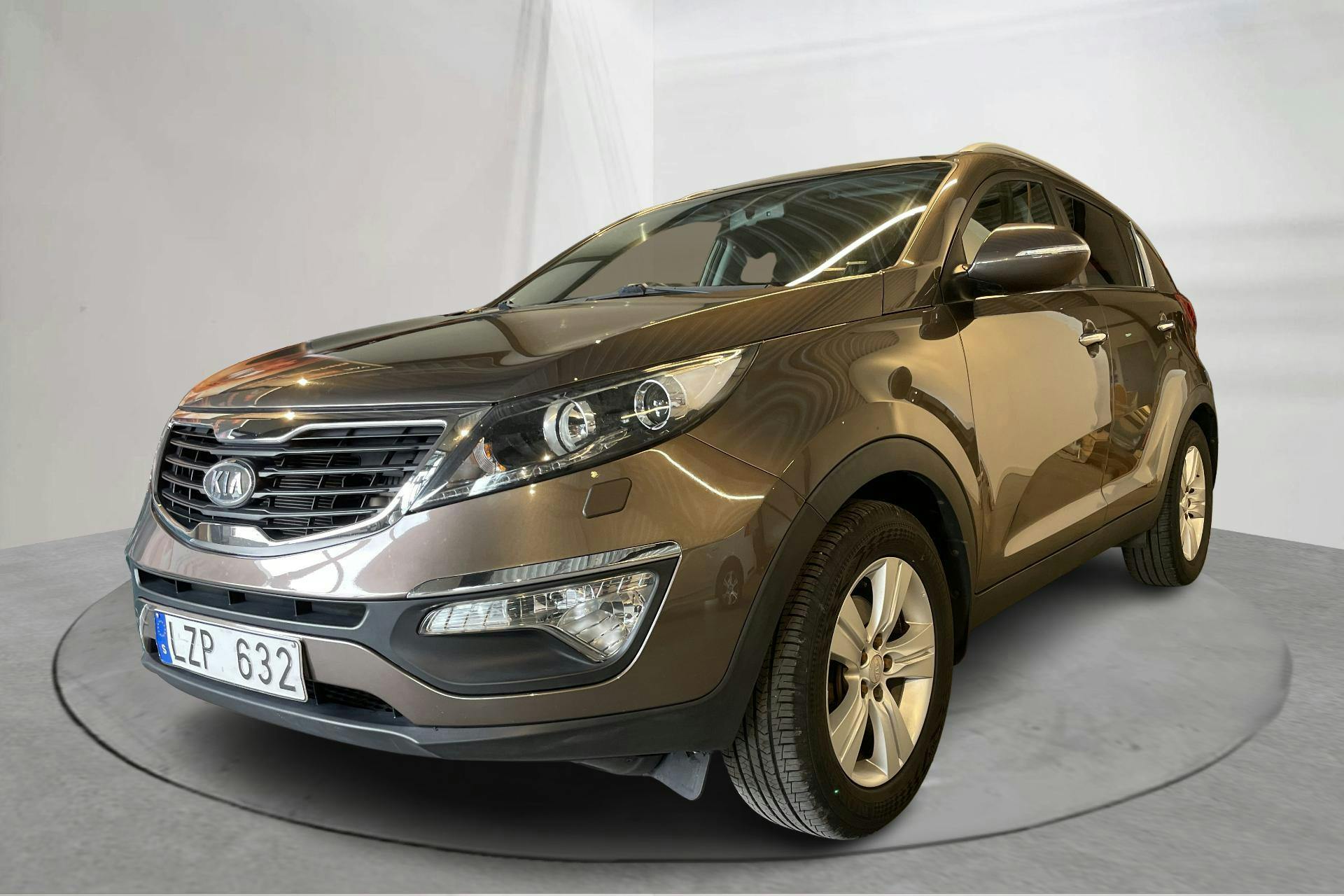 Presentationsfoto 1 av 14: KIA Sportage 1.7 CRDi 2WD (115hk) - 12 434 mil - Manuell - Light Brown - 2012